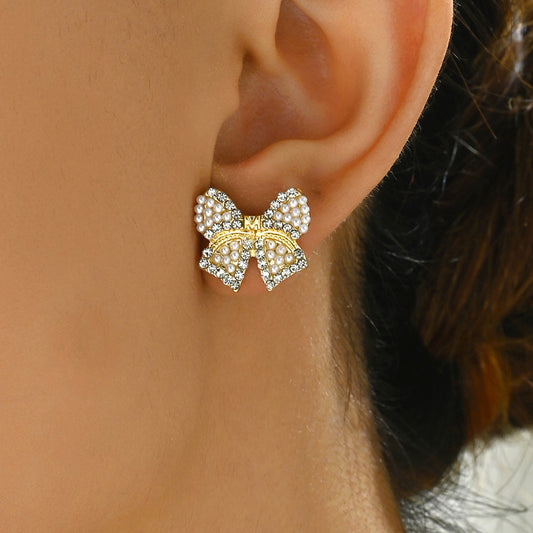 Pendientes de aleación con forma de lazo minimalistas con incrustaciones de perlas para mujer, joyería de moda para orejas Primavera Verano 2024