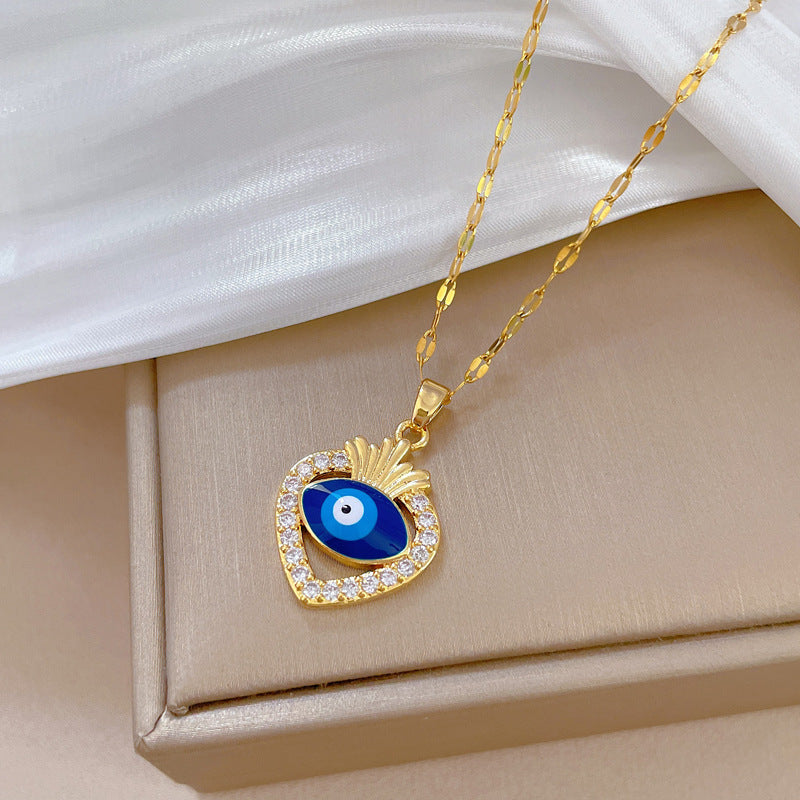 Collana con ciondolo in acciaio al titanio di lusso con motivo geometrico a occhio di Allah e strass, a forma di luna, unisex