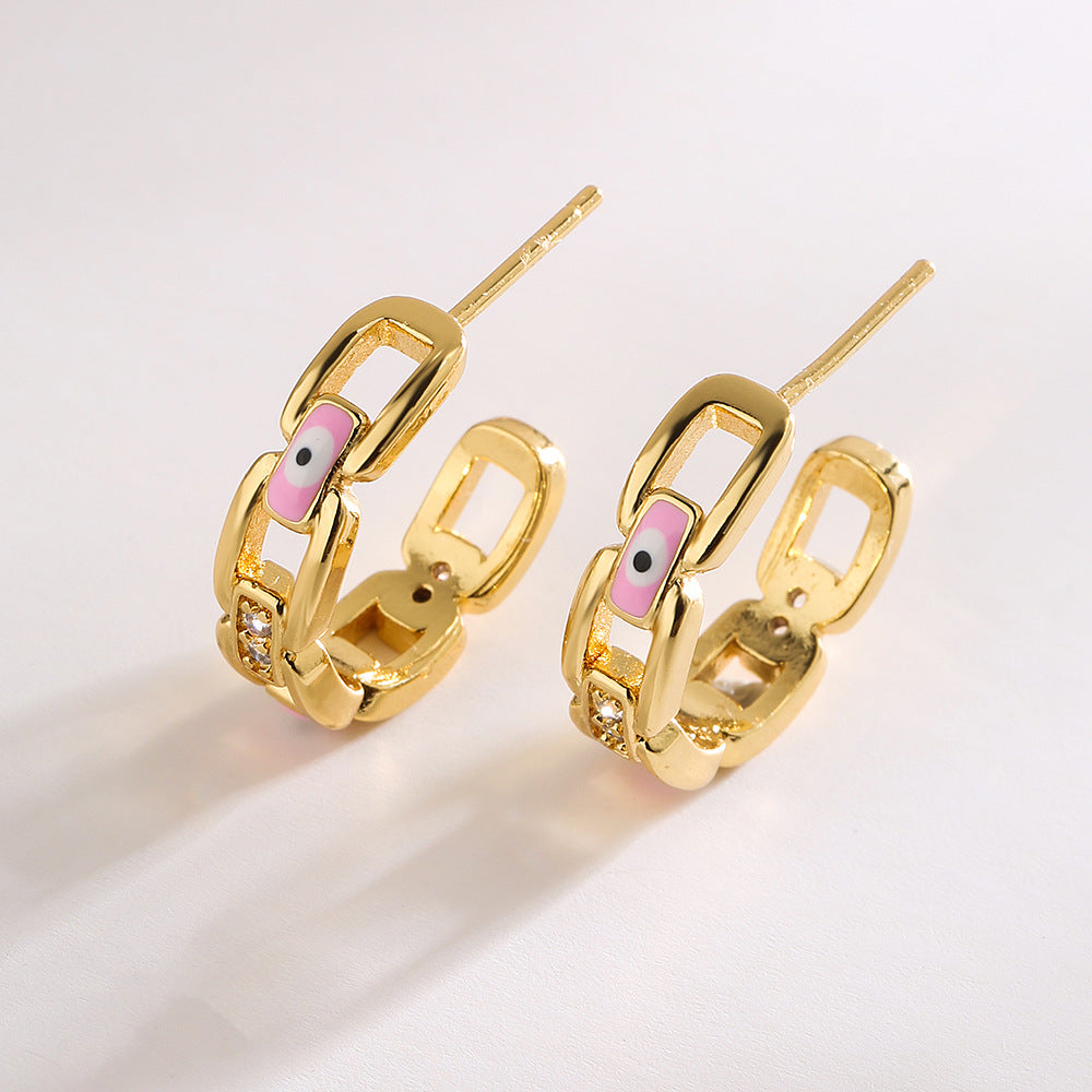 Orecchini geometrici in rame placcato oro con smalto a forma di occhio per donna