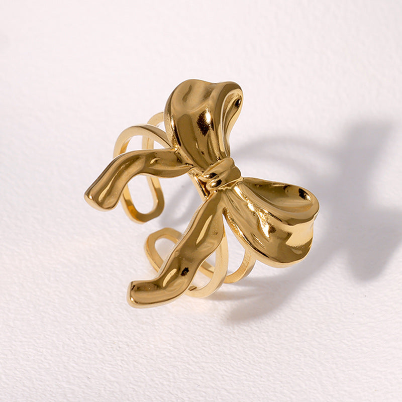 Anello da donna minimalista dolce a forma di fiocco in acciaio inossidabile con finitura placcata, fascia aperta regolabile