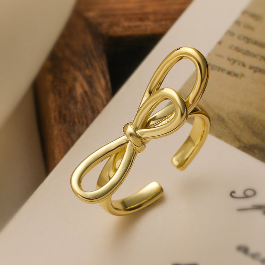 Minimalist Hollow Bowknot Ring for Women in Copper with 18K Gold Plating, Geometric and Irregular Design
