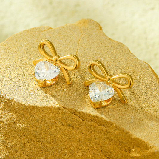Pendientes de tuerca de acero inoxidable con forma de lazo de moda para mujer con detalles de pedrería y acabado chapado