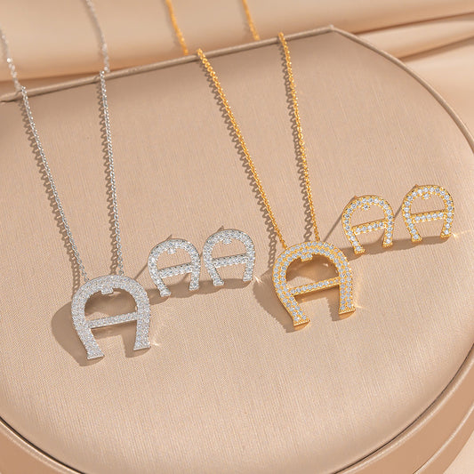 Fashion-Forward U-Shaped Horseshoe Pendant Necklace Set in Eco-Friendly Copper with Rhinestone Inlay and Gold Plating for Women