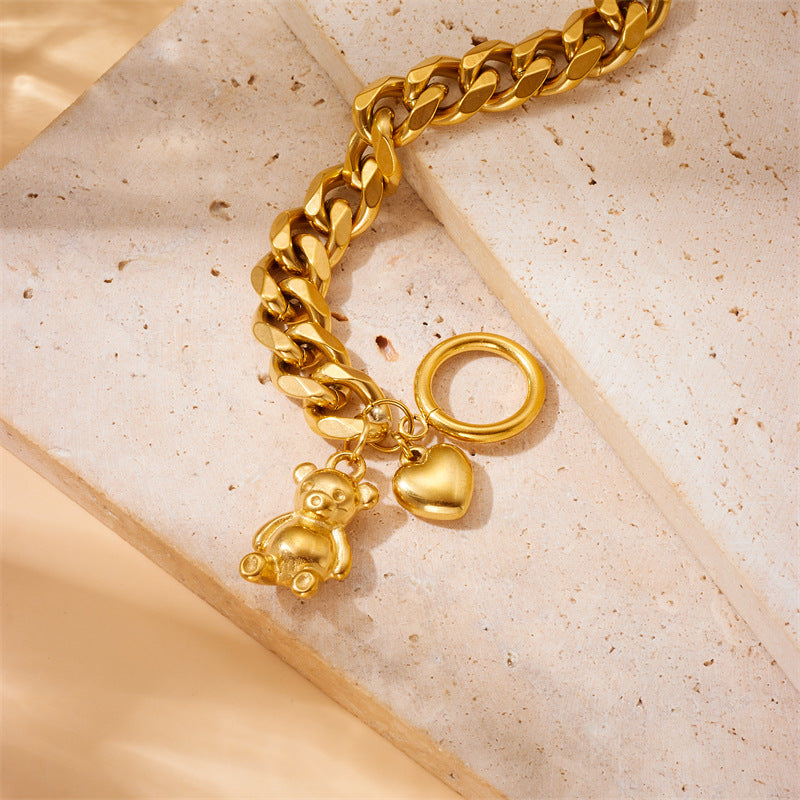 Bracciale da donna placcato oro in acciaio inossidabile con ciondoli a orsetto e cuore e chiusura a moschettone