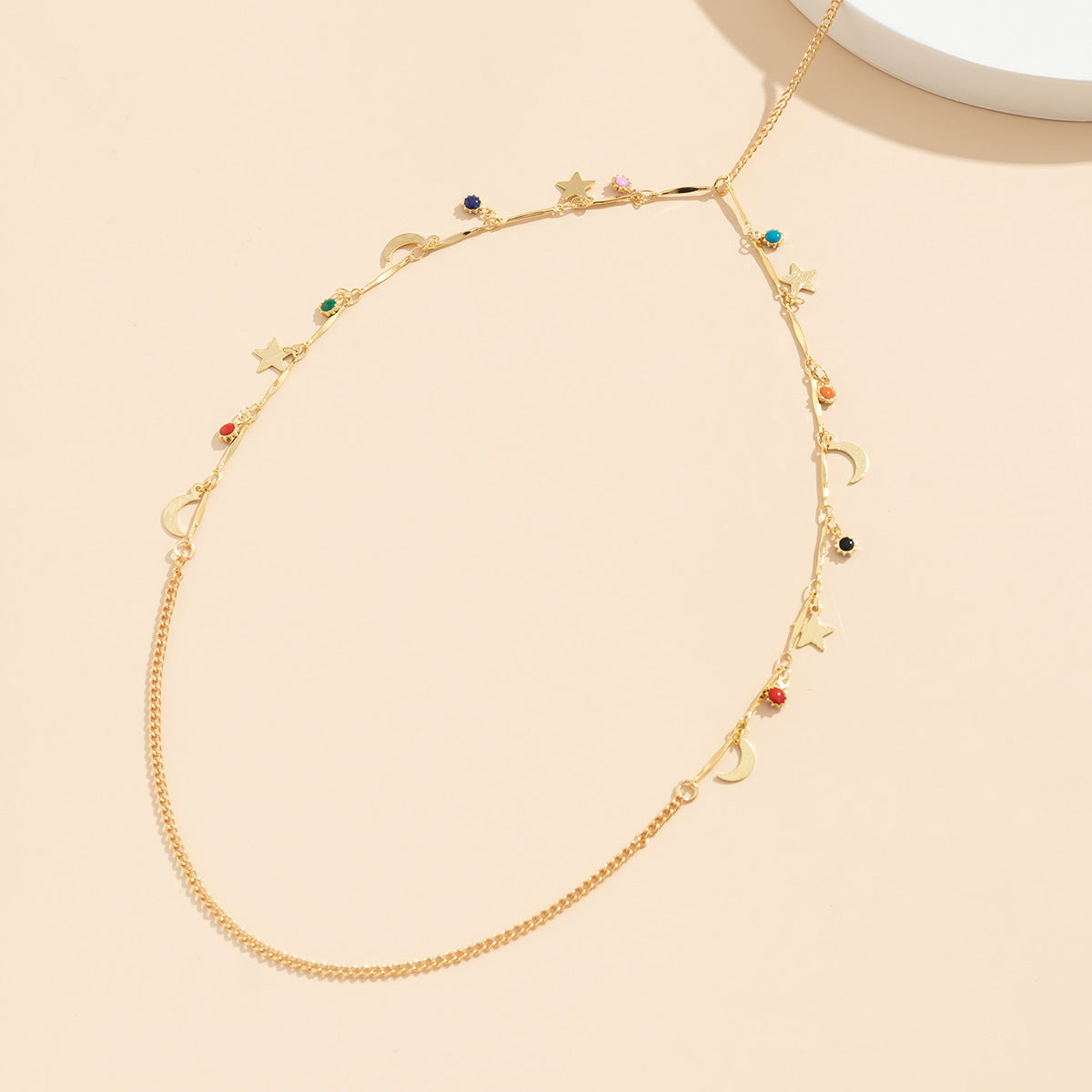 Catena a corpo a stella minimalista in lega da donna con finitura smaltata e design a frange