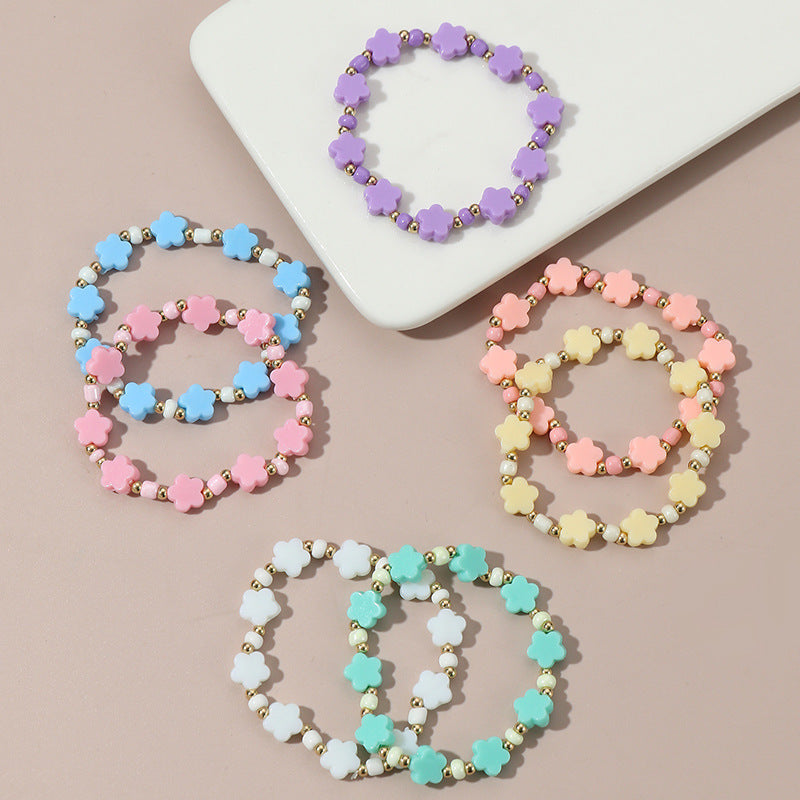 Braccialetto Minimalista a Stella con Perline per Bambini Realizzato in Plastica e Resina con Accenti Floreali Colorati