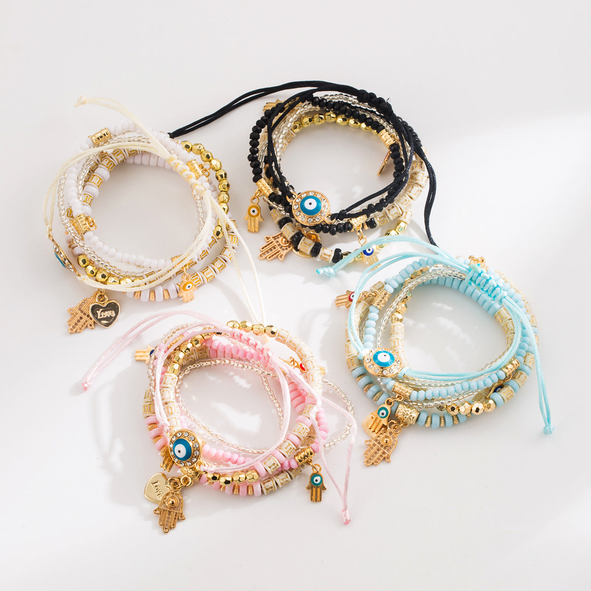 Set di bracciali multistrato esotici con perline infilate a mano, con design a forma di occhio in lega e perline di conteria per donna