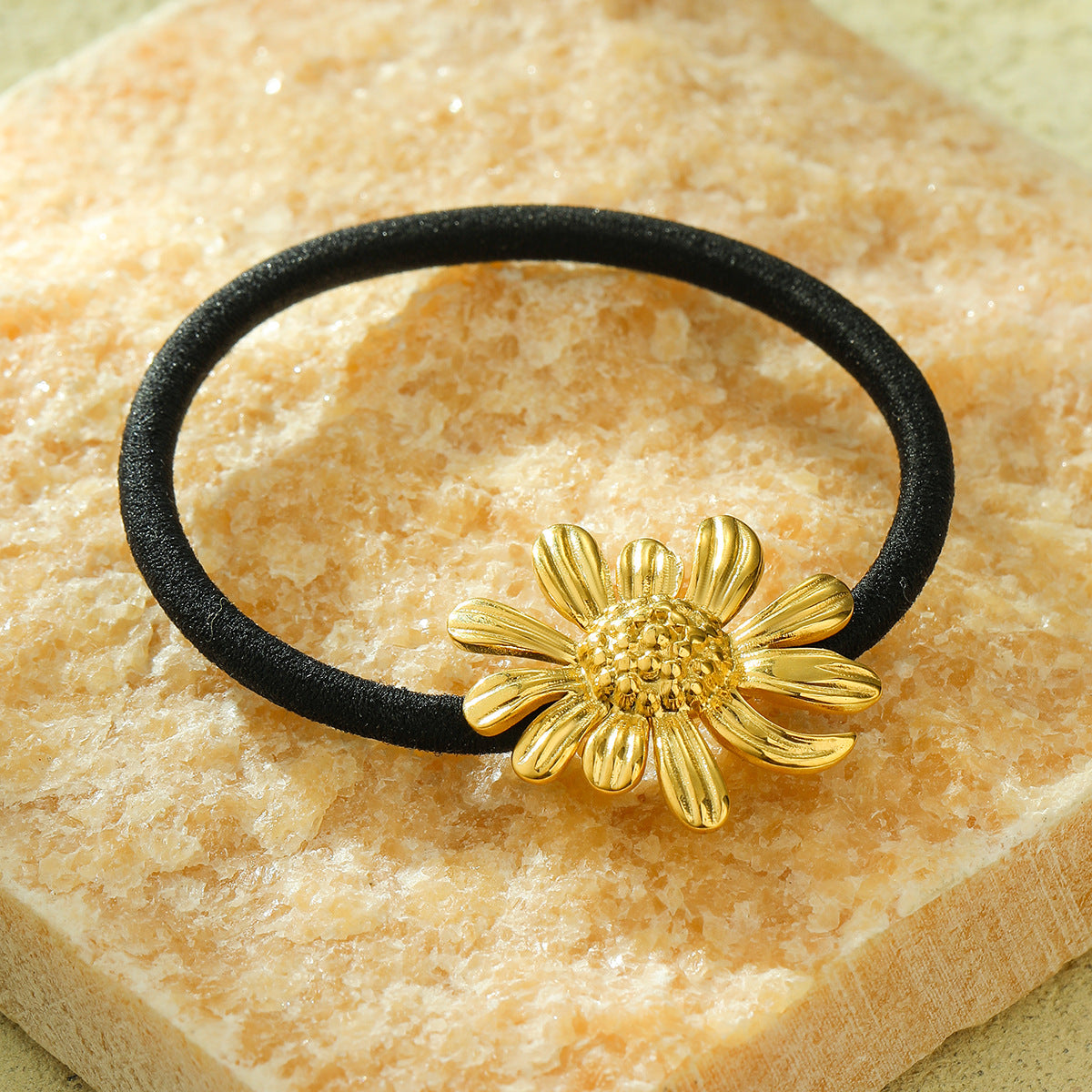 Diadema minimalista de acero de titanio con forma de girasol y acabado chapado para mujer