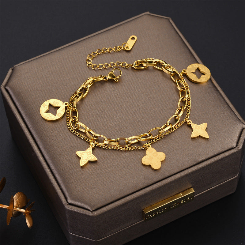 Elegante Pulsera Minimalista de Acero de Titanio con Colgante Redondo Bañado en Oro de 18K y Dije de Hoja para Mujer