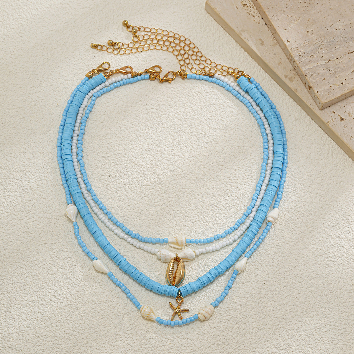 Collana bohémien vintage a strati con ciondolo a stella in conchiglia, lega galvanizzata, catena con perline