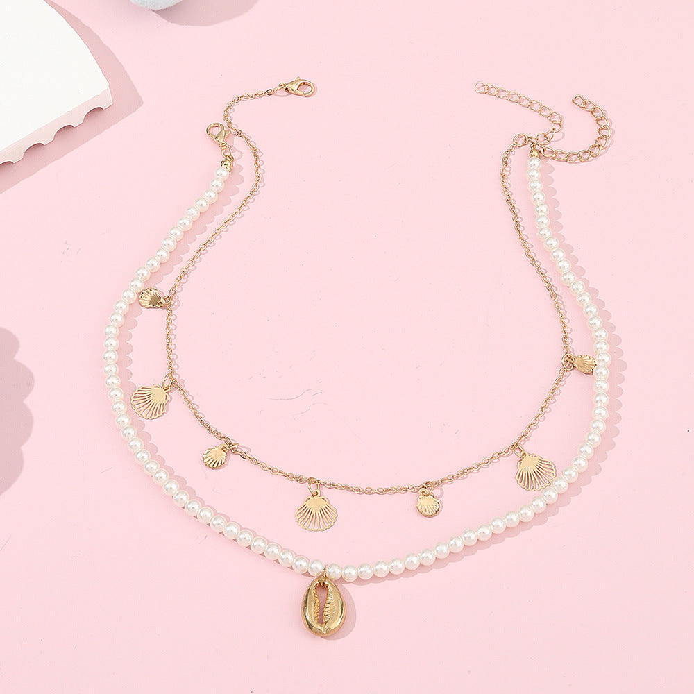 Set di collana con ciondolo a forma di conchiglia minimalista in lega per ragazze con catena di perle e finitura artigianale