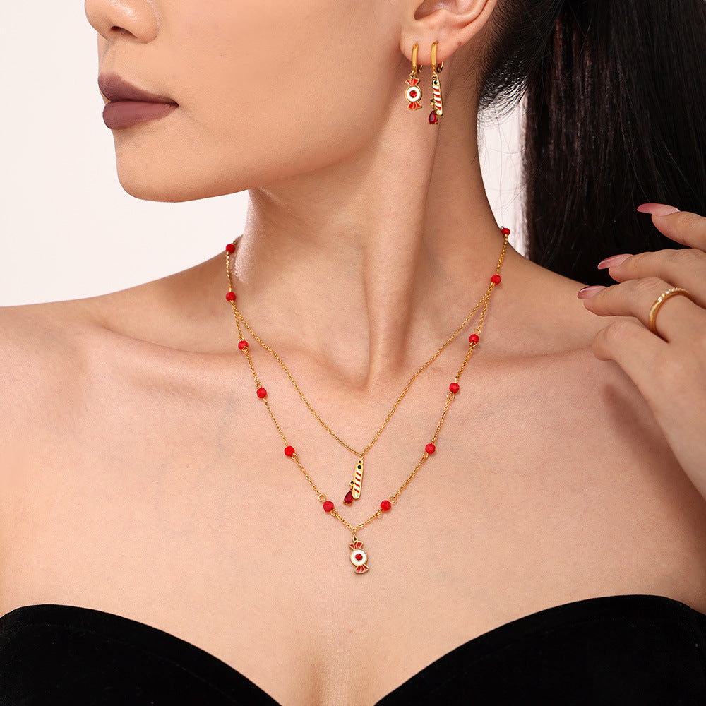 Collana con pendente a forma di caramella a ruota panoramica di lusso con catena in acciaio inossidabile, strass e accenti di granato, dettagli in smalto, da donna