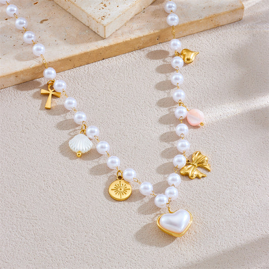 Collar con dije de corazón y lazo de moda en acero inoxidable con acabado chapado para mujer
