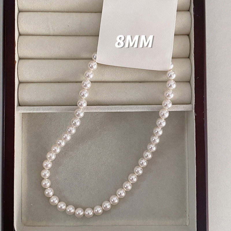 Elegante Collana da Donna Ispirata alla Francia con Perle e Pendente a U, Accenti di Perle Sintetiche e Madreperla, Finitura Placcata, Delicata Catena alla Clavicola