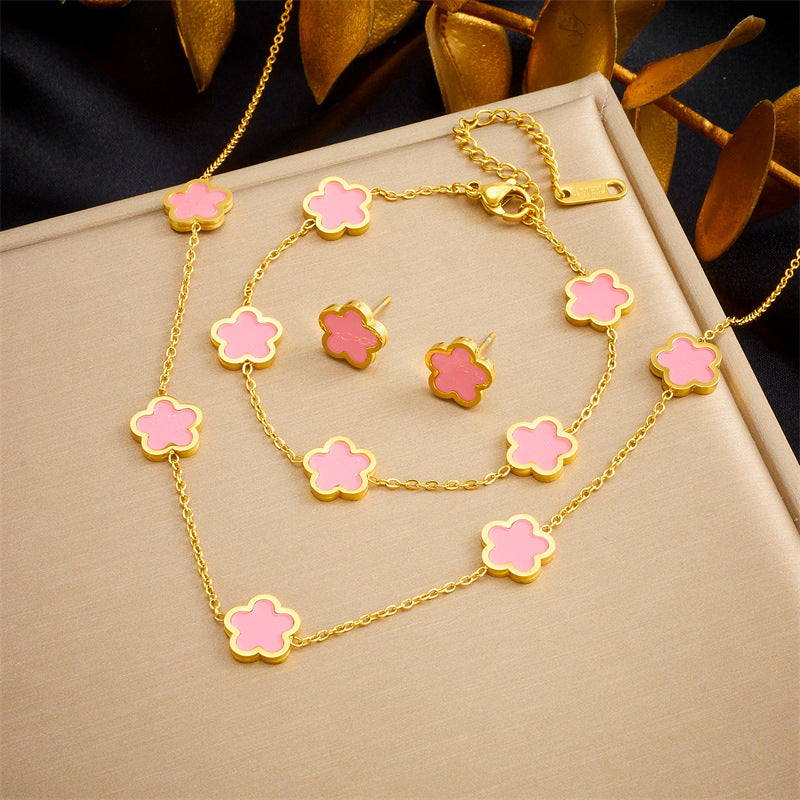Set de pendientes, pulsera y collar chapados en acero inoxidable con diseño de flores vintage de cinco pétalos para mujer