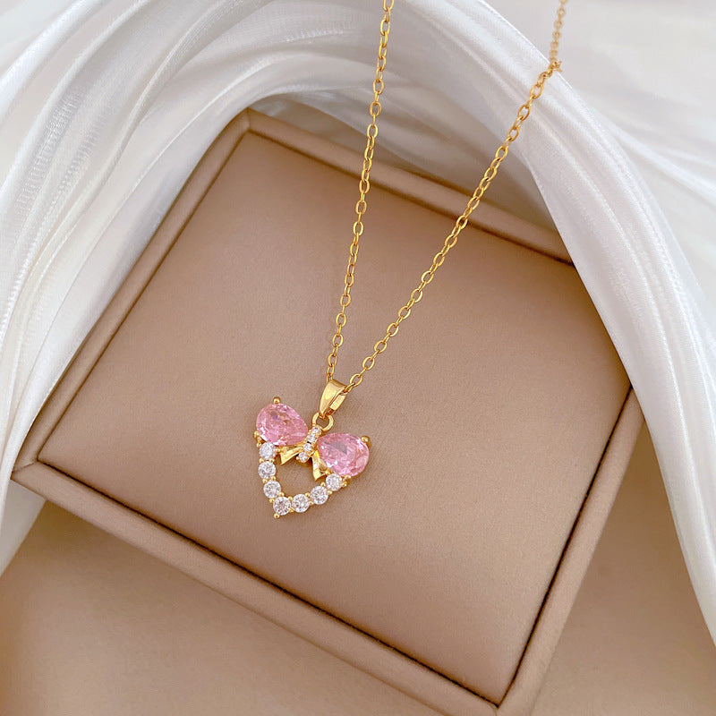 Collana da donna minimalista con fiocco e zirconi a forma di cuore, in acciaio inossidabile, catena delicata per clavicola