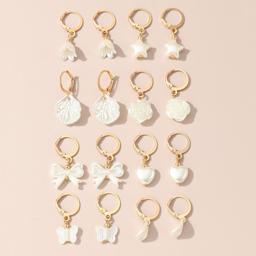 Pendientes de perlas en forma de lazo minimalistas para niñas en metal con acabado artesanal