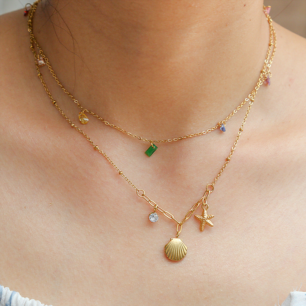 Collar con colgante de concha y estrella minimalista inspirado en el océano en acero inoxidable con baño de oro de 18 quilates en cadena O