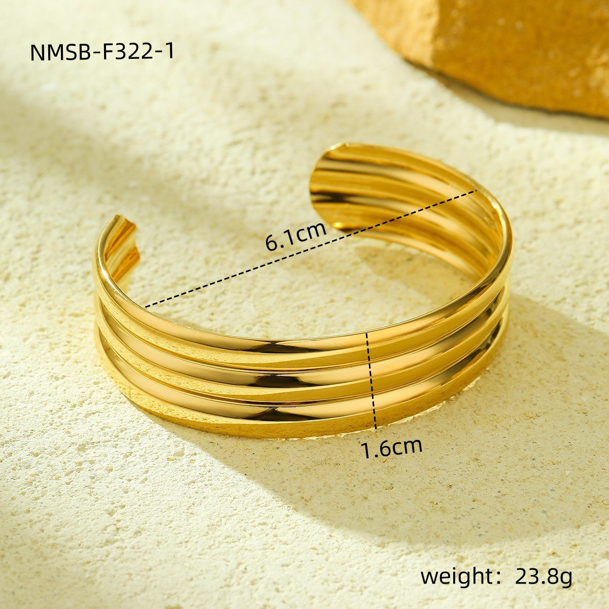 Pulsera de acero titanio de estilo vintage con acabado pulido y patrón circular texturizado para mujer