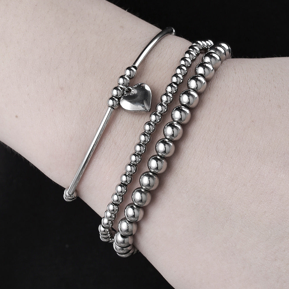 Set bracciale con ciondolo a cuore geometrico in acciaio inossidabile da donna con perline miste e design impilabile
