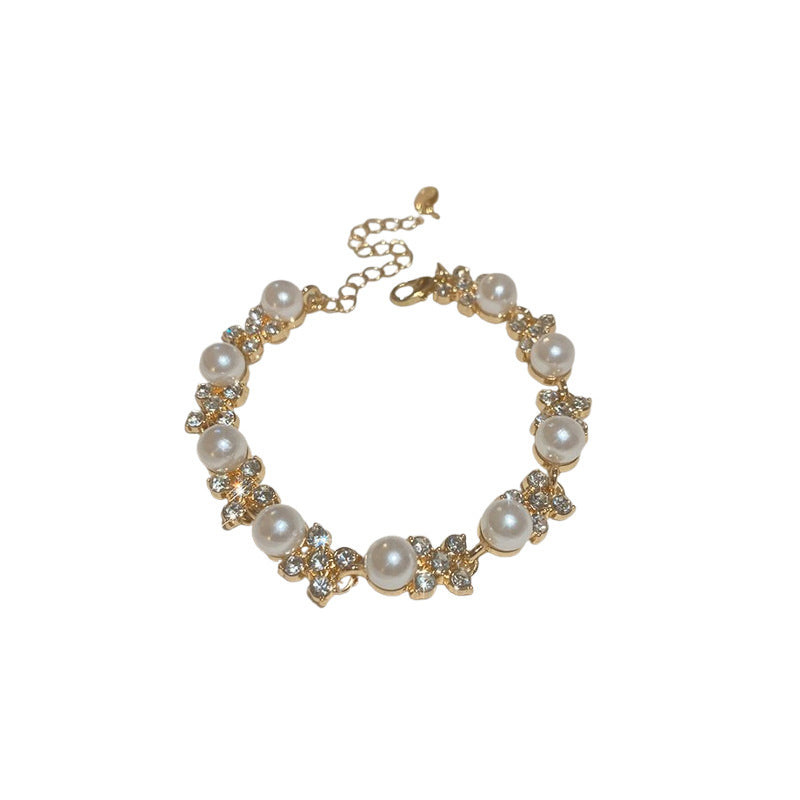 Elegante juego de collar redondo de perlas florales con incrustaciones de circonita para mujer, incluye pendientes, pulsera y cadena de clavícula
