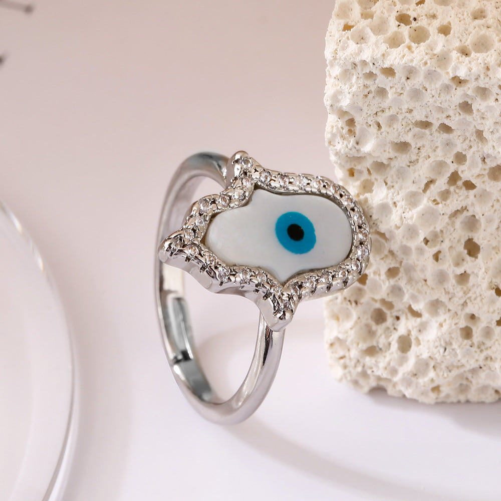 Anello da donna minimalista geometrico in rame placcato oro con micro-pavé di zirconi a forma di occhio turco