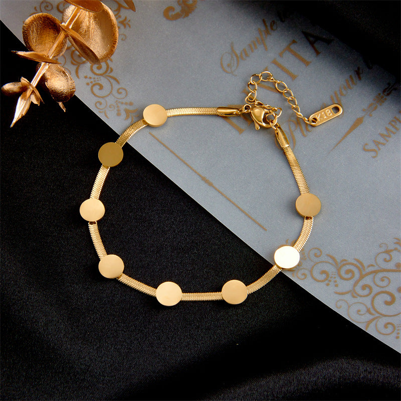 Elegante set minimalista de pulsera y collar de cadena de serpiente para mujer de acero de titanio chapado en oro con colgantes de disco redondo