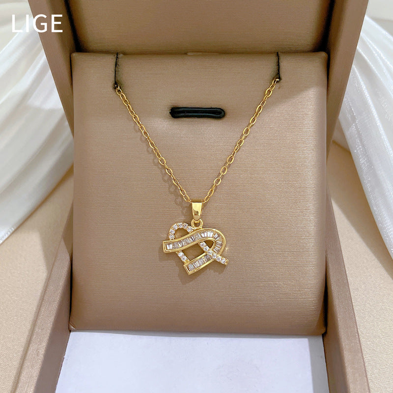 Parure di collana e orecchini da donna di lusso in acciaio al titanio con strass a cuore geometrico