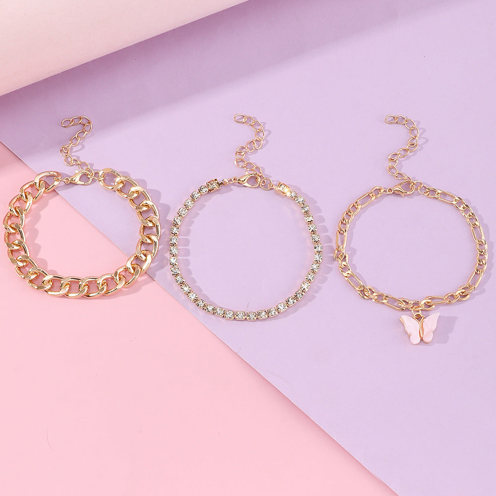 Pulsera de aleación con forma de mariposa estilo punk con incrustaciones de diamantes de imitación y acabado esmaltado para mujer