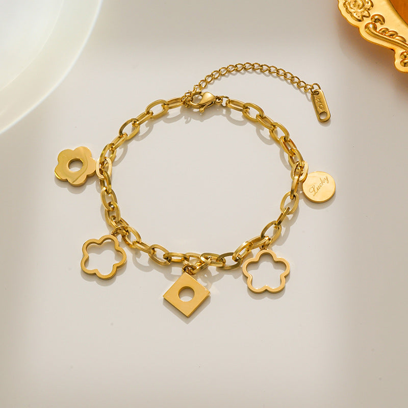 Bracciale da donna alla moda in acciaio al titanio a forma di rombo con ciondolo a fiore