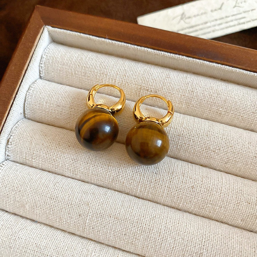 Pendientes de botón de acero chapado de estilo lujoso con perlas de imitación y detalles de ojo de tigre con diseño floral para mujer