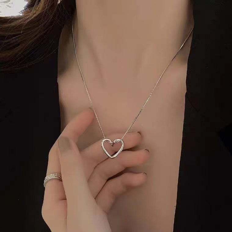 Minimalist French Style Hollow Heart Titanium Steel Clavicle Necklace for Women with Gold Plating and Snake Chain