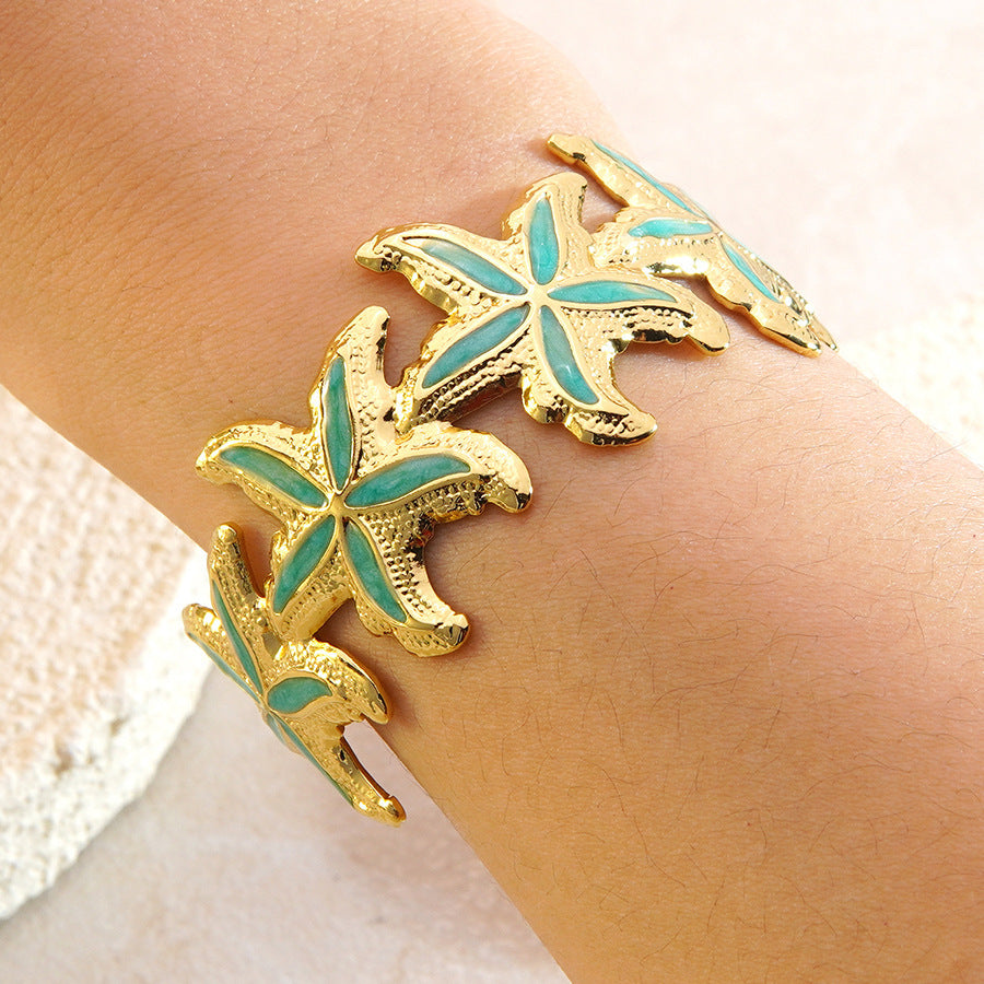Elegante Bracciale a Polsino in Acciaio Inossidabile con Stella Marina e Goccia d'Olio