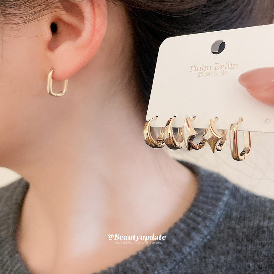 Orecchini a perno da donna a forma di stella geometrica in metallo con finitura lucida e superficie galvanizzata, gioielli alla moda minimalisti per tutti i giorni