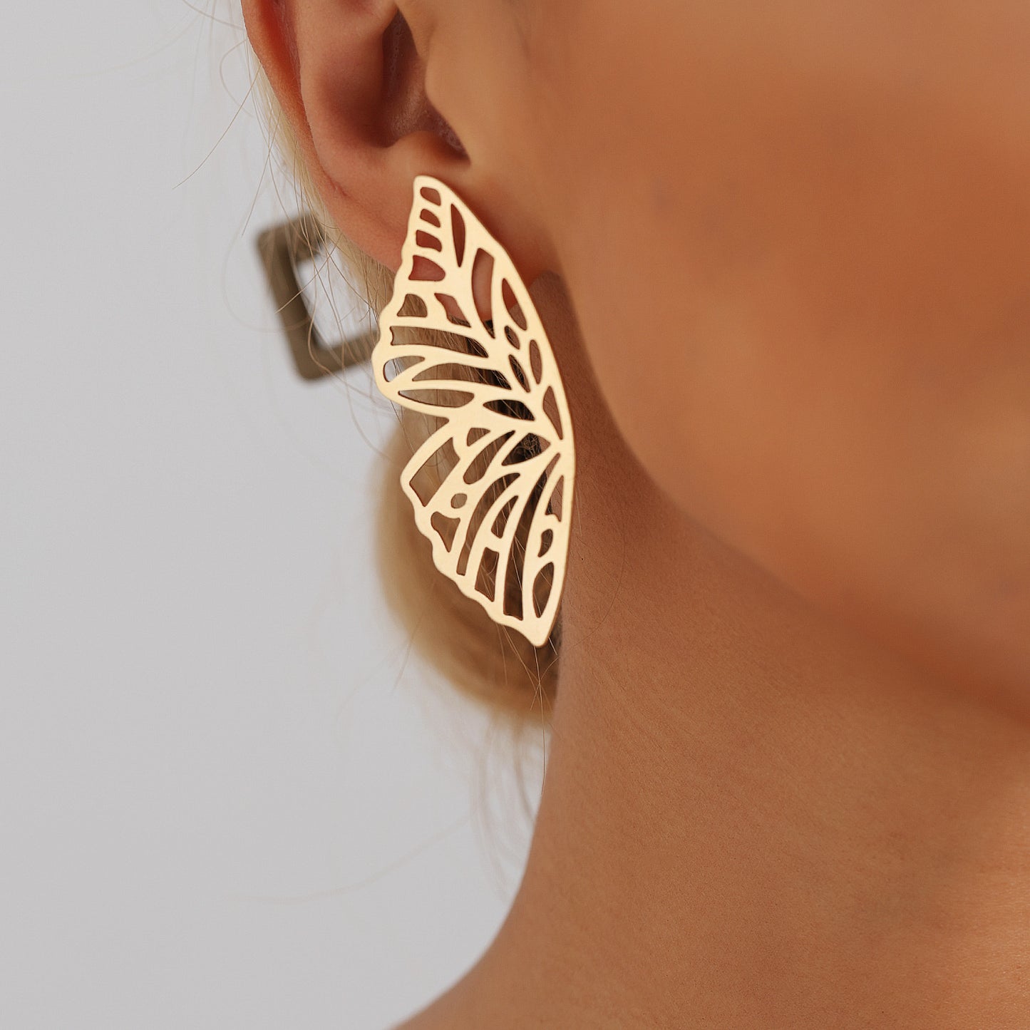 Punk Style Butterfly-Shaped Hollow Alloy Stud Earrings for Women with Plated Finish