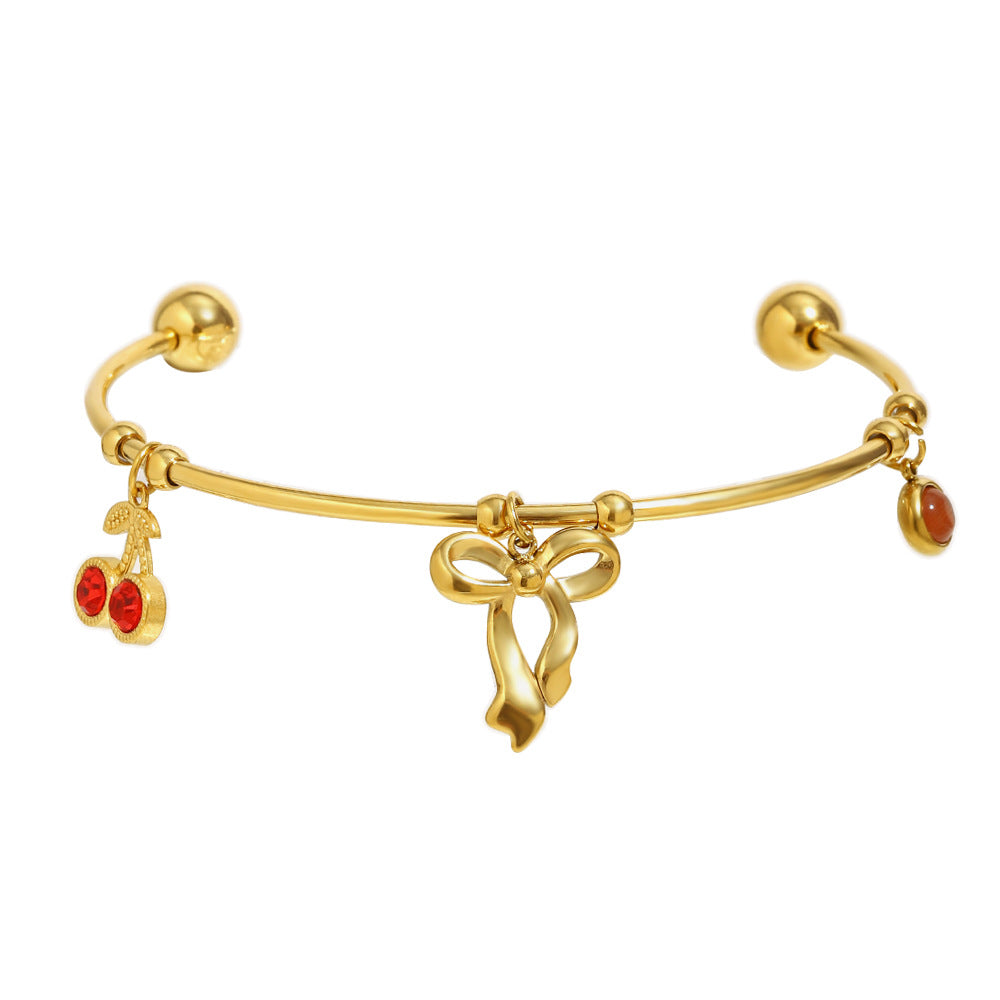 Elegant Fashionable Bowknot-Shaped Stainless Steel Plated 18K Gold C-Shaped Bracelet with Red Rhinestone Cherry Accent