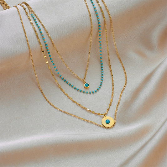 Collana con Pendente Minimalista Geometrica Irregolare in Acciaio al Titanio con Intarsio Turchese e Finitura Placcata per Donne