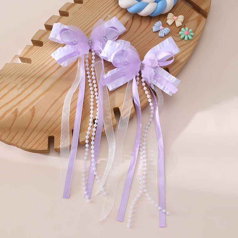 Pinza de pelo en forma de lazo de estilo natural para niños con detalles de volantes y malla hecha de resina plástica