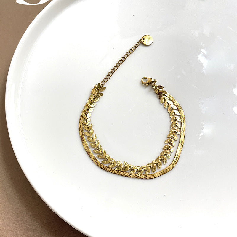 Pulsera minimalista de doble capa de trigo y hojas para mujer con construcción de acero de titanio y baño de oro