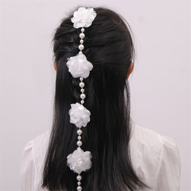 Lindo broche para el cabello en forma de lazo con adorno floral blanco, detalles de perlas y borlas para niñas