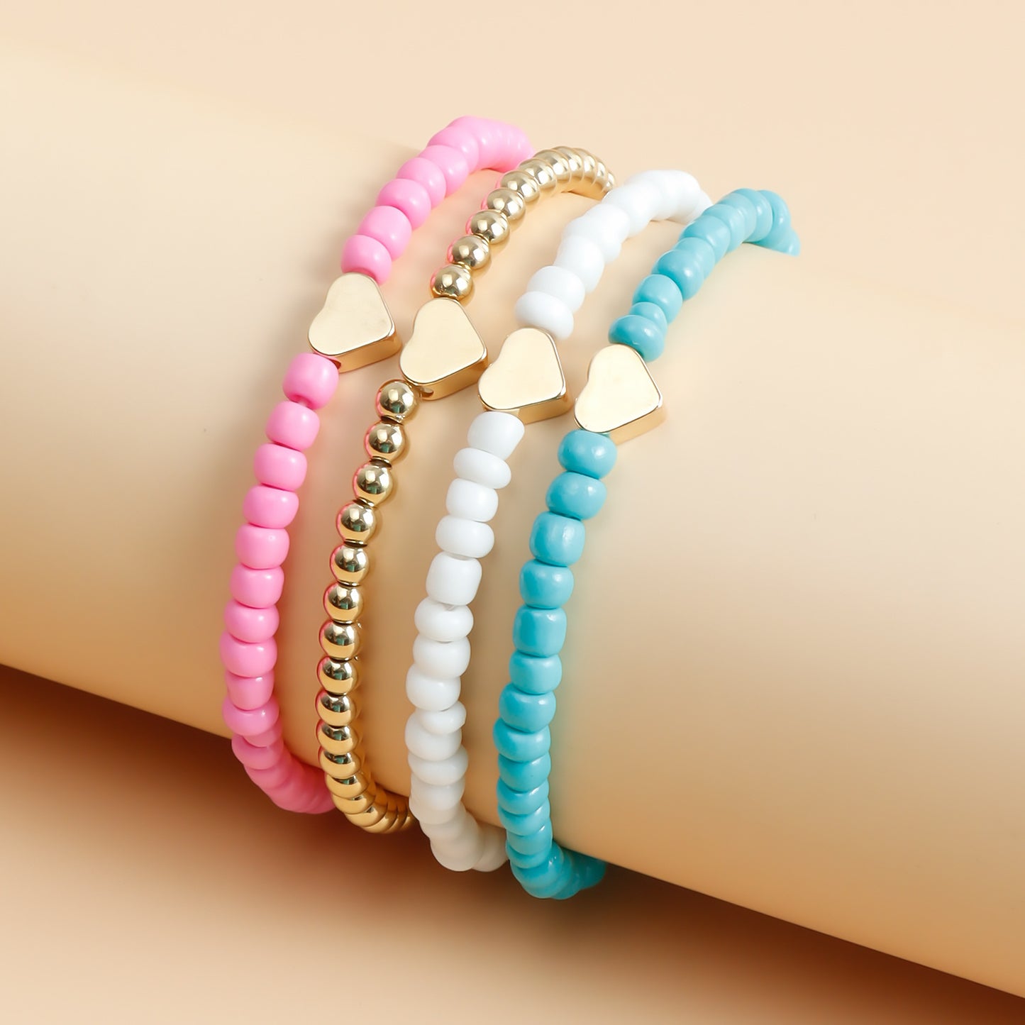 Pulsera elástica bohemia hecha a mano con abalorios, diseño geométrico y en forma de corazón, con cuentas de semillas de colores y acabado chapado
