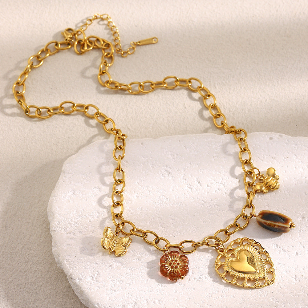 Luxury Vintage Hollow Heart Pendant Necklace in Stainless Steel with 18K Gold Plating on O-Chain