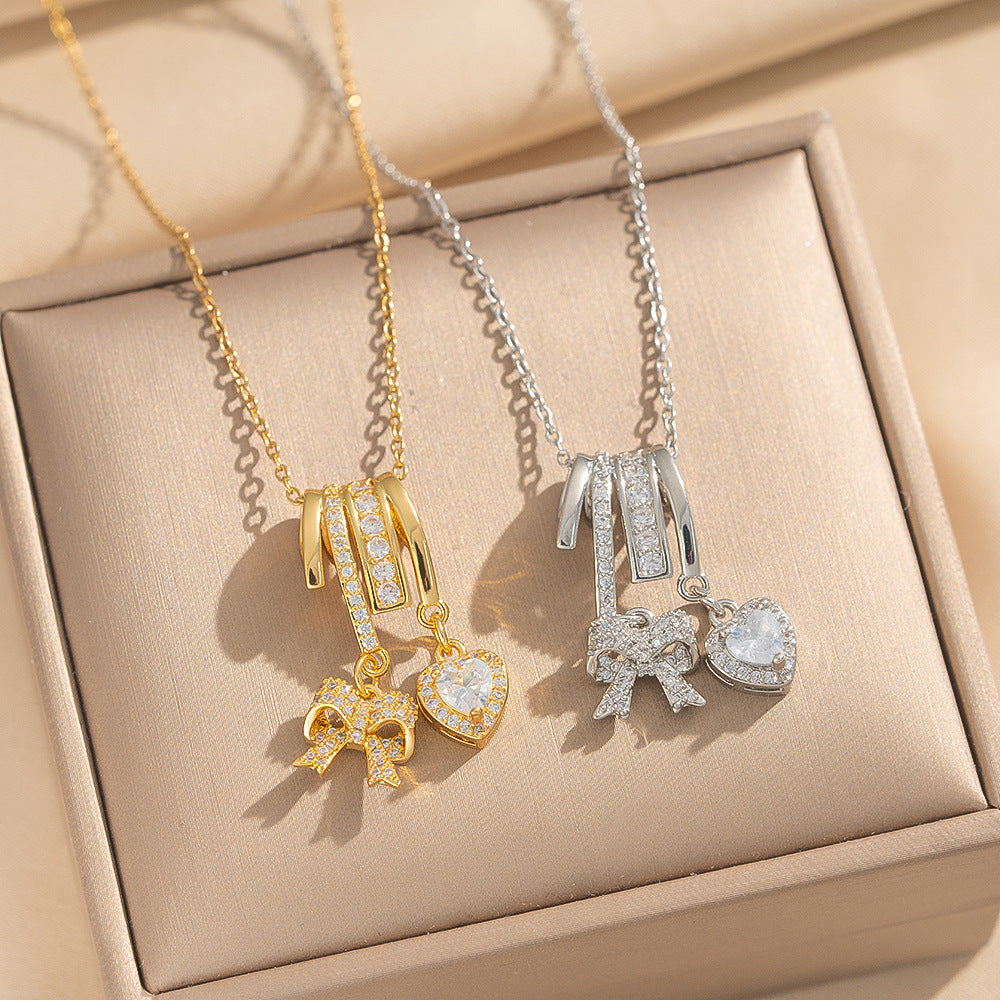 Collana Pendente Lusso Minimalista a Fiocco e Cuore in Acciaio al Titanio Placcato Oro su Catena a O per Unisex