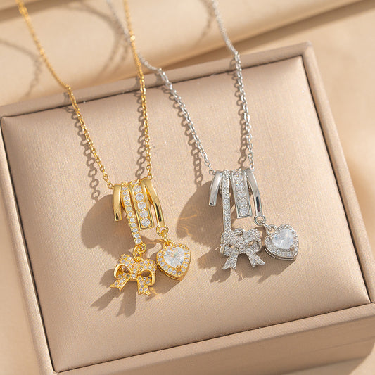 Collana Pendente Lusso Minimalista a Fiocco e Cuore in Acciaio al Titanio Placcato Oro su Catena a O per Unisex