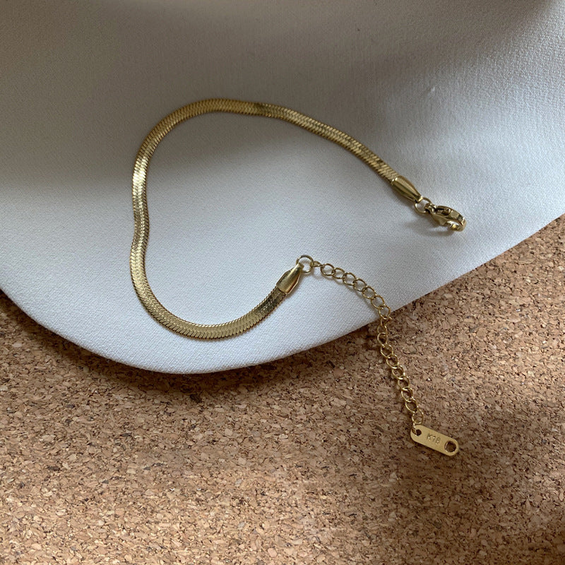 Cavigliera Minimalista in Acciaio al Titanio Argentato con Ciondolo a Cuore e Maglia a Serpente per Donna