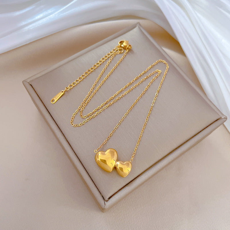 Collana Minimalista Unisex con Doppio Cuore Geometrico in Acciaio al Titanio