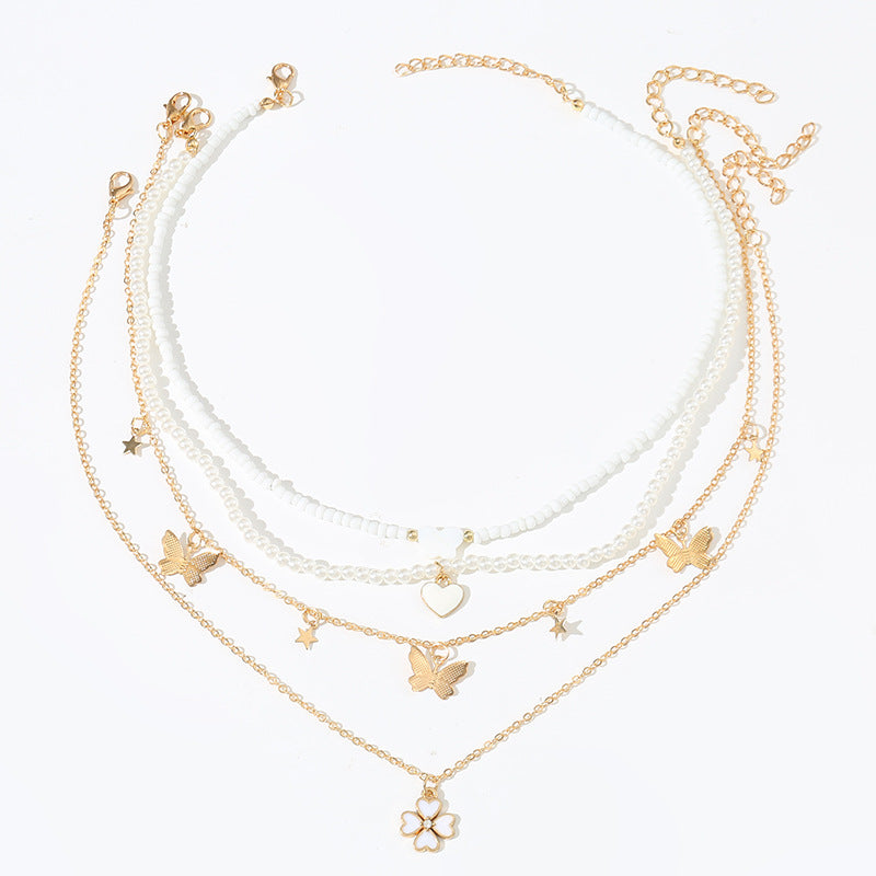 Bonito collar con dije de aleación esmaltado en forma de corazón para niños con cadena de eslabones torcidos
