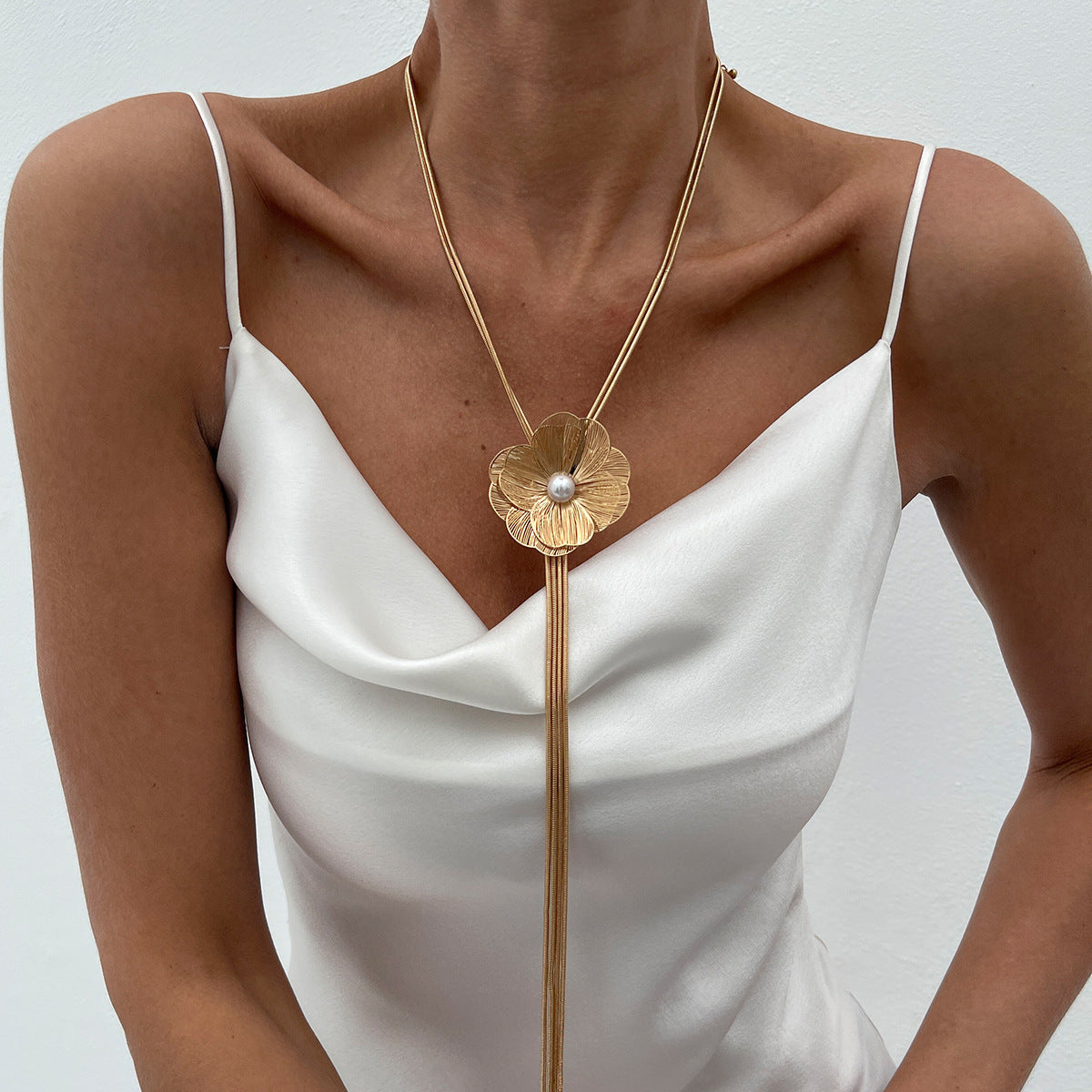 Minimalist Ginkgo Leaf Long Tassel Necklace with Hollow Floral Pendant, Electroplated Copper Chain and Simulated Pearl Accents for Women