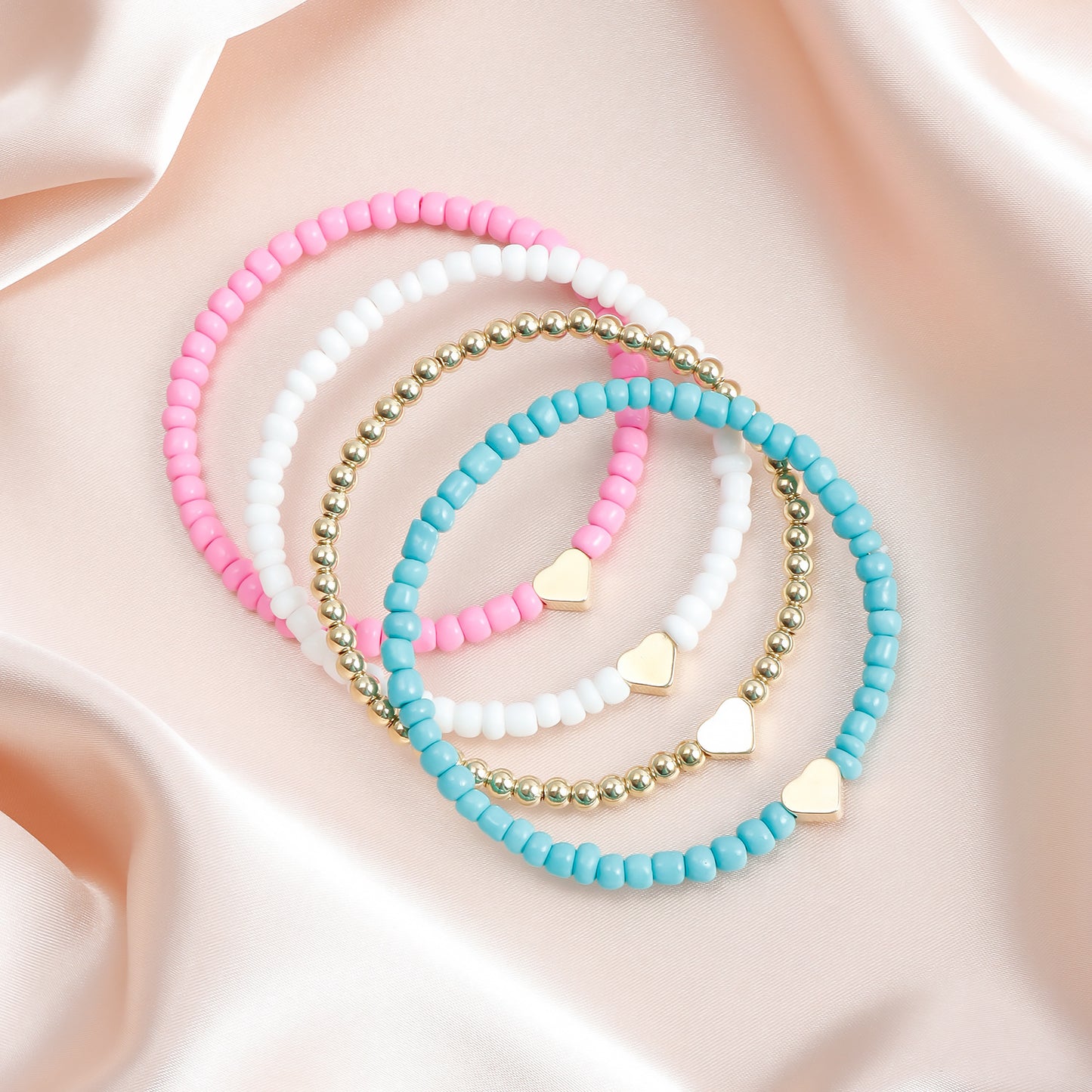 Pulsera elástica bohemia hecha a mano con abalorios, diseño geométrico y en forma de corazón, con cuentas de semillas de colores y acabado chapado