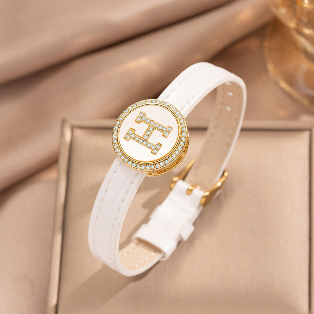 Pulsera de puño redonda chapada en oro de acero inoxidable minimalista con correa de cuero genuino para hombres y mujeres